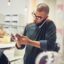 Business,,Man,And,Phone,Call,With,Tablet,At,Cafe,For